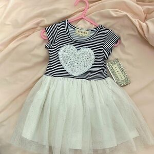 Brand new with tags.  Baby girls dress 12mo
